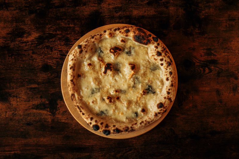 Four Cheese marco pizza with mozzarella gorgonzola parmesan and ricotta